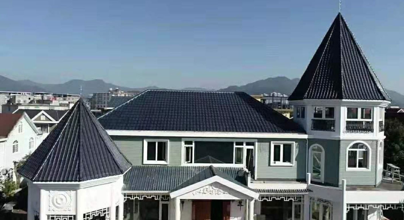 Dark building-integrated photovoltaic roof tiles forming the finished roof covering