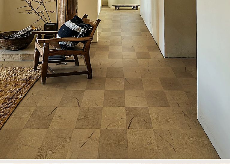 Wood-grain square flooring laid along a hallway beside chairs