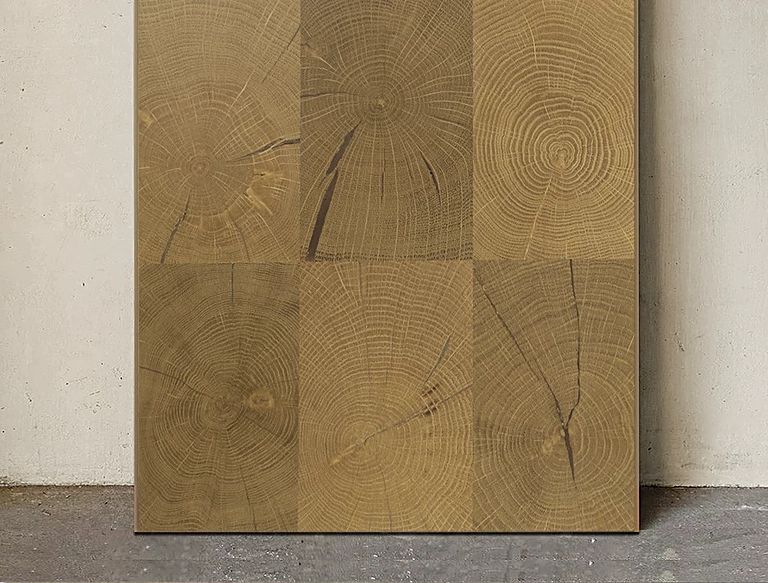 Square wood-grain flooring sample showing alternating grain directions