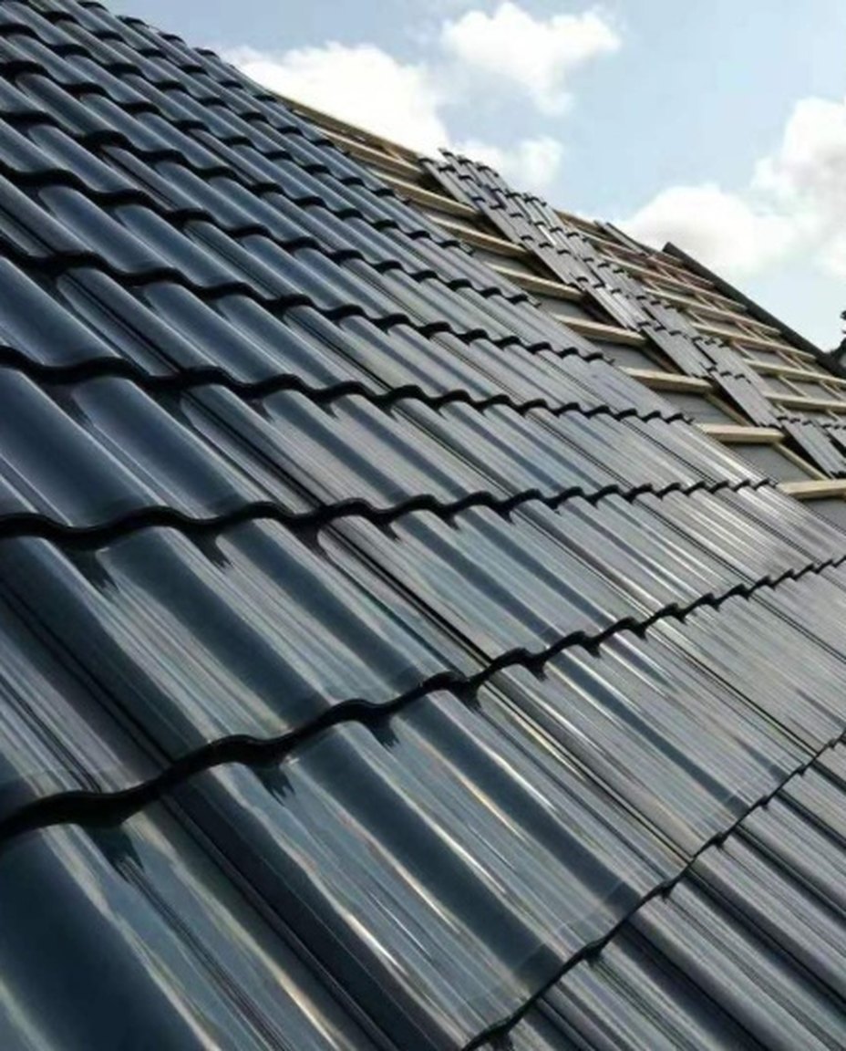 Close view of arched glass solar tiles lapped in courses